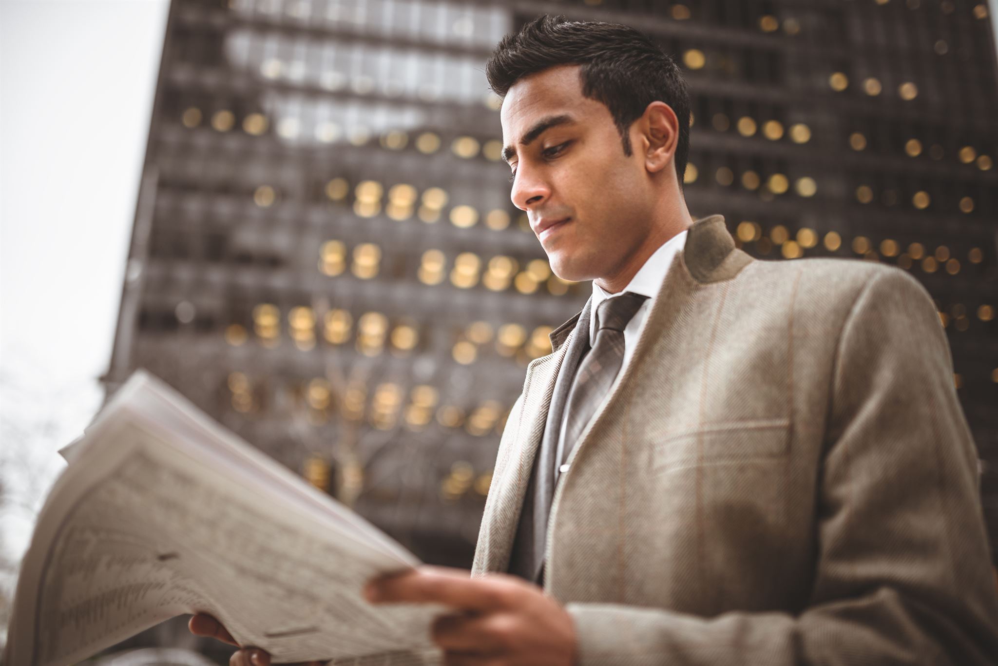 Young-man-reading-newspaper